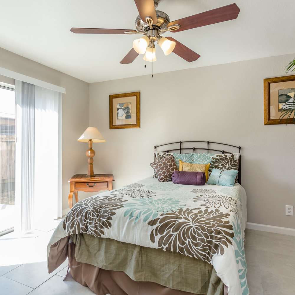 Bedroom with a ceiling fan at La Carmona in Houston, Texas