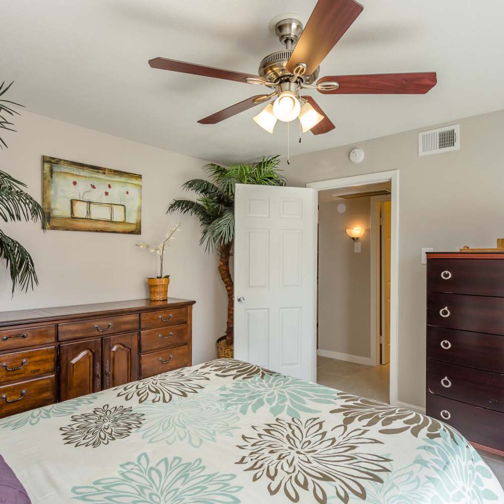 Bedroom with a bed and a dresser at La Carmona in Houston, Texas