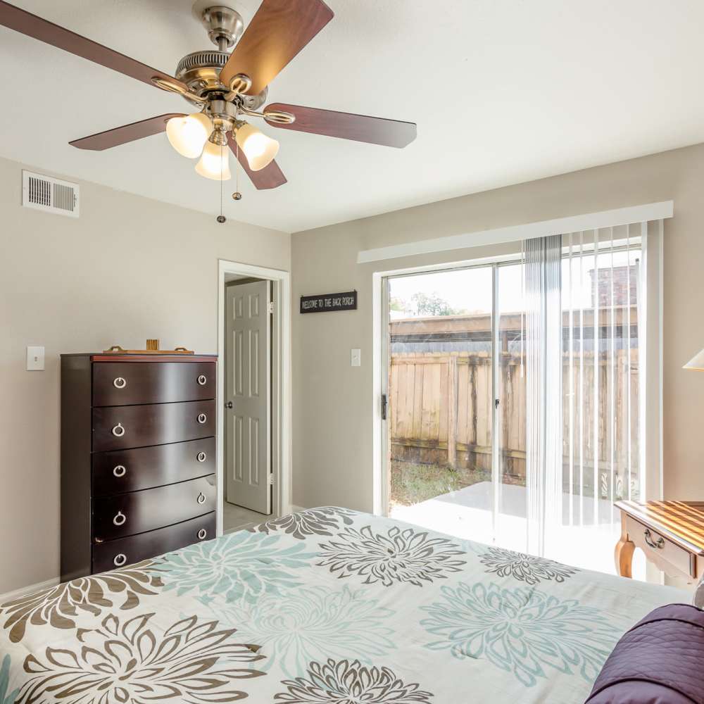 Bedroom with large closets at La Carmona in Houston, Texas