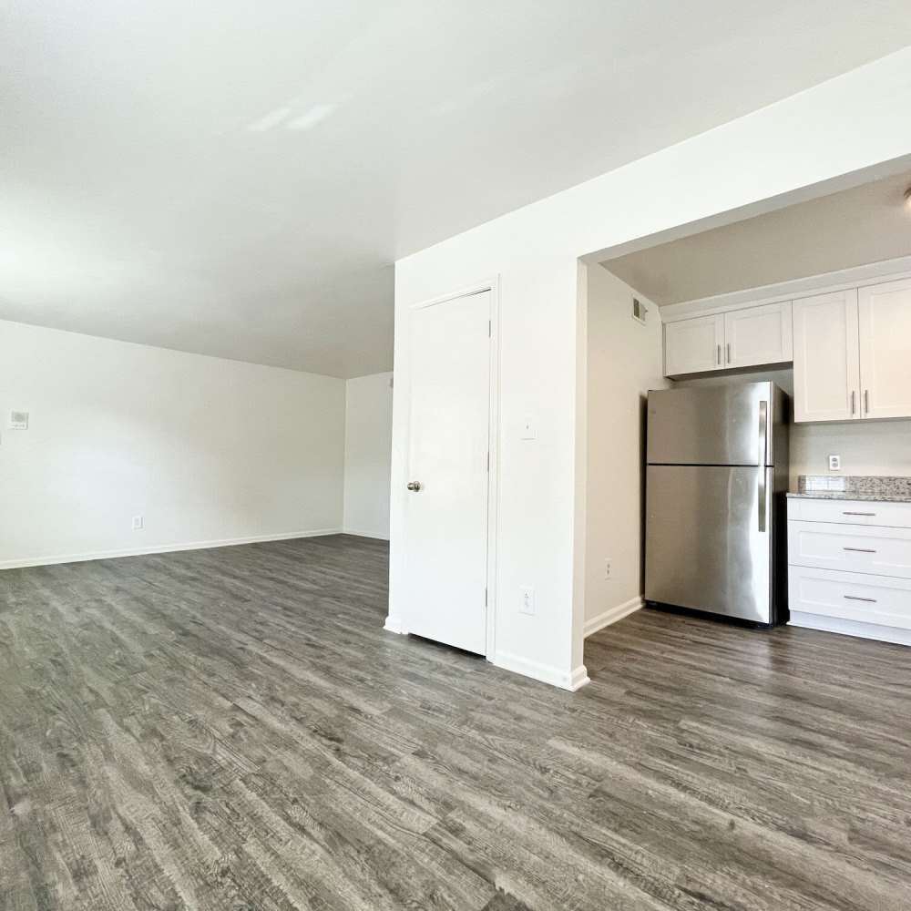 Kitchen space with wood-style flooring at Great Bridge Apartments in Chesapeake, Virginia