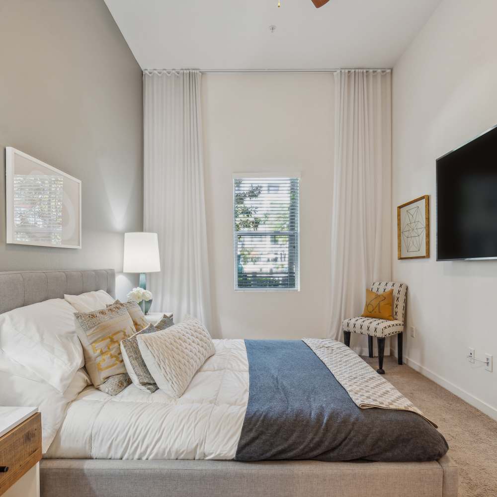 Bedroom with a ceiling fan at Nineteen01 in Santa Ana, California
