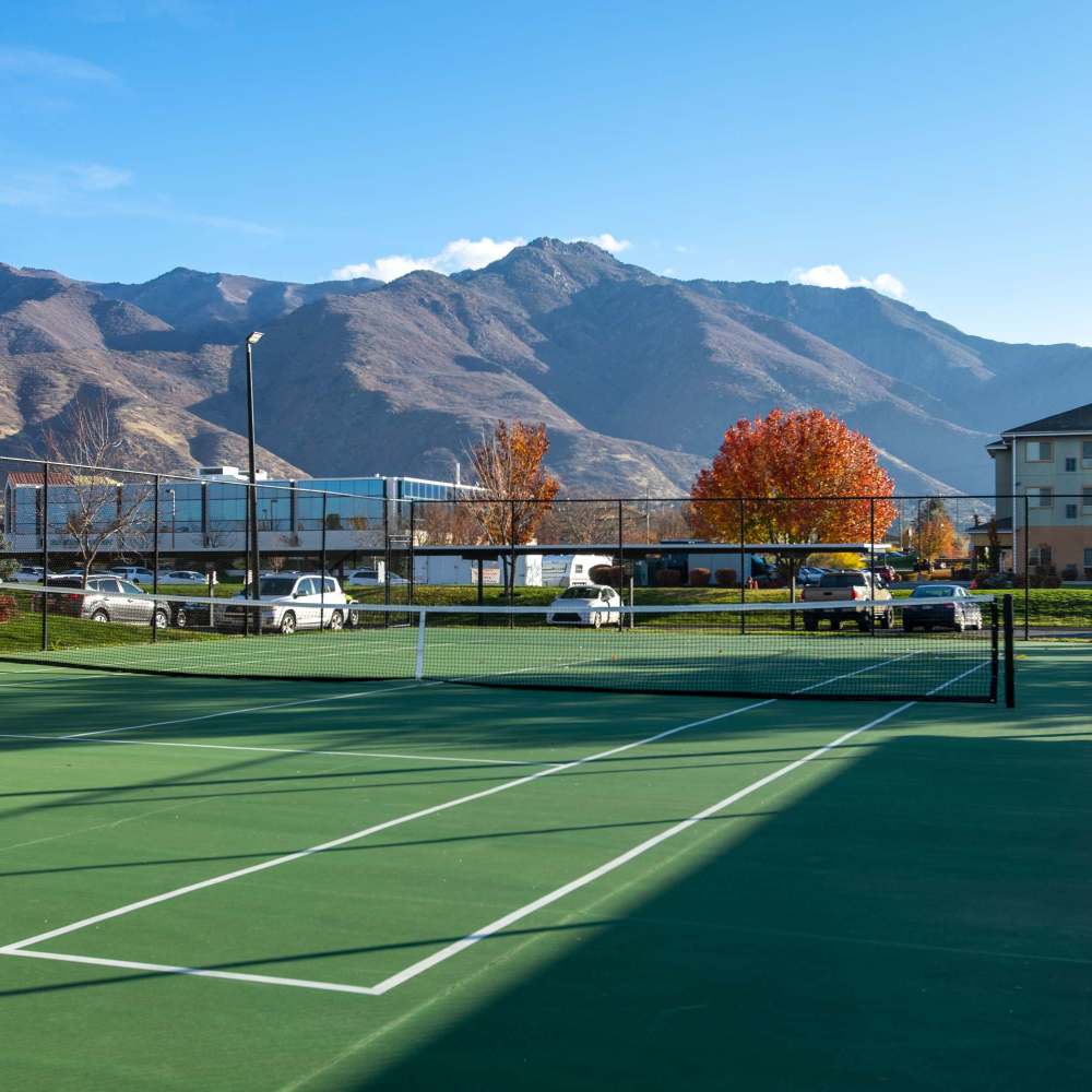 Tennis court with mountain views at The Falls at Canyon Rim in South Ogden, Utah