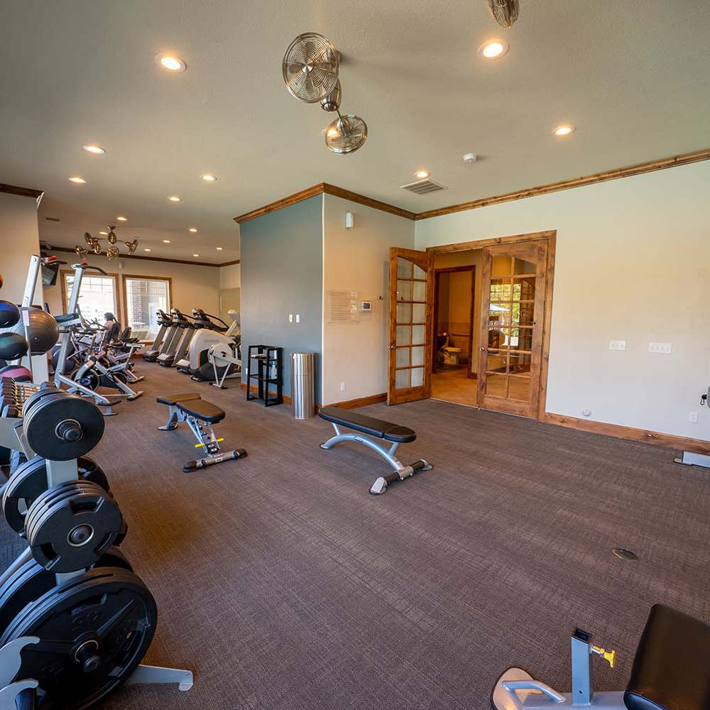Fitness center with exercise and strength machines at The Falls at Canyon Rim in South Ogden, Utah