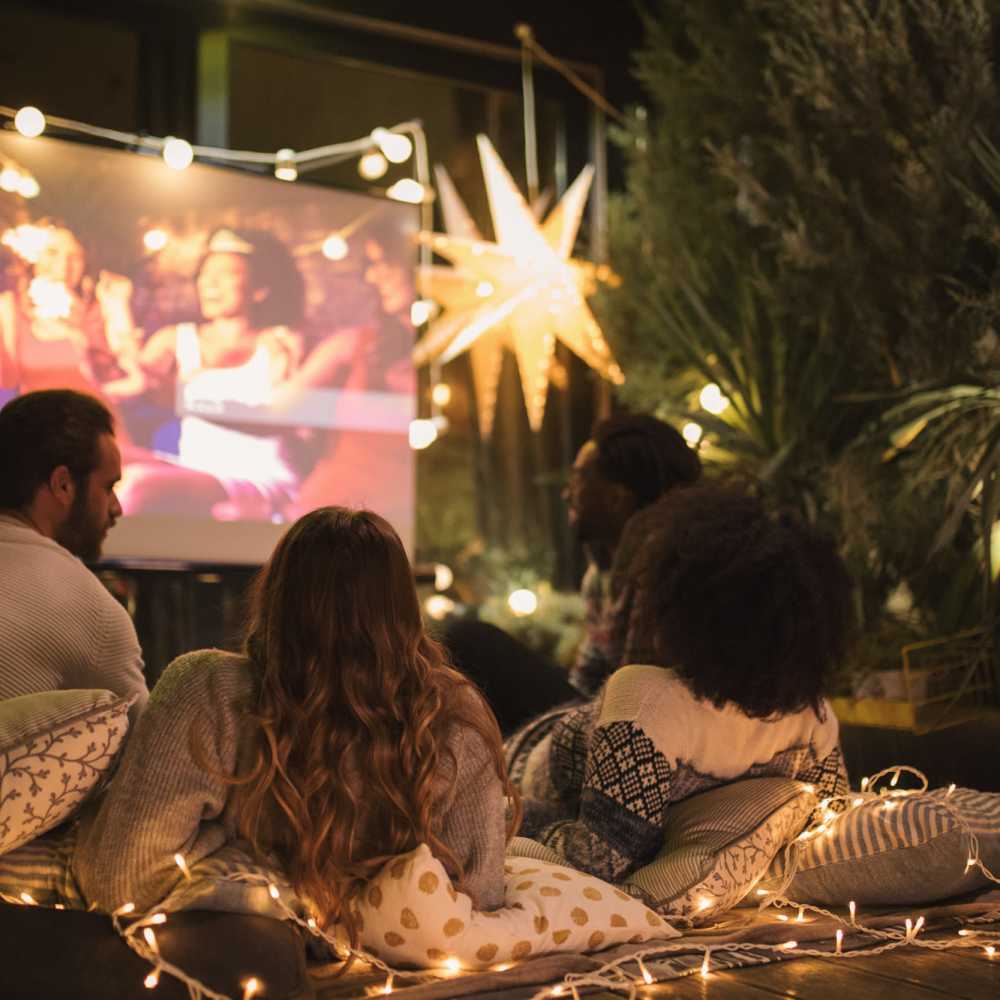 Residents watching a movie at 301 Monroe Place in Hoboken, New Jersey