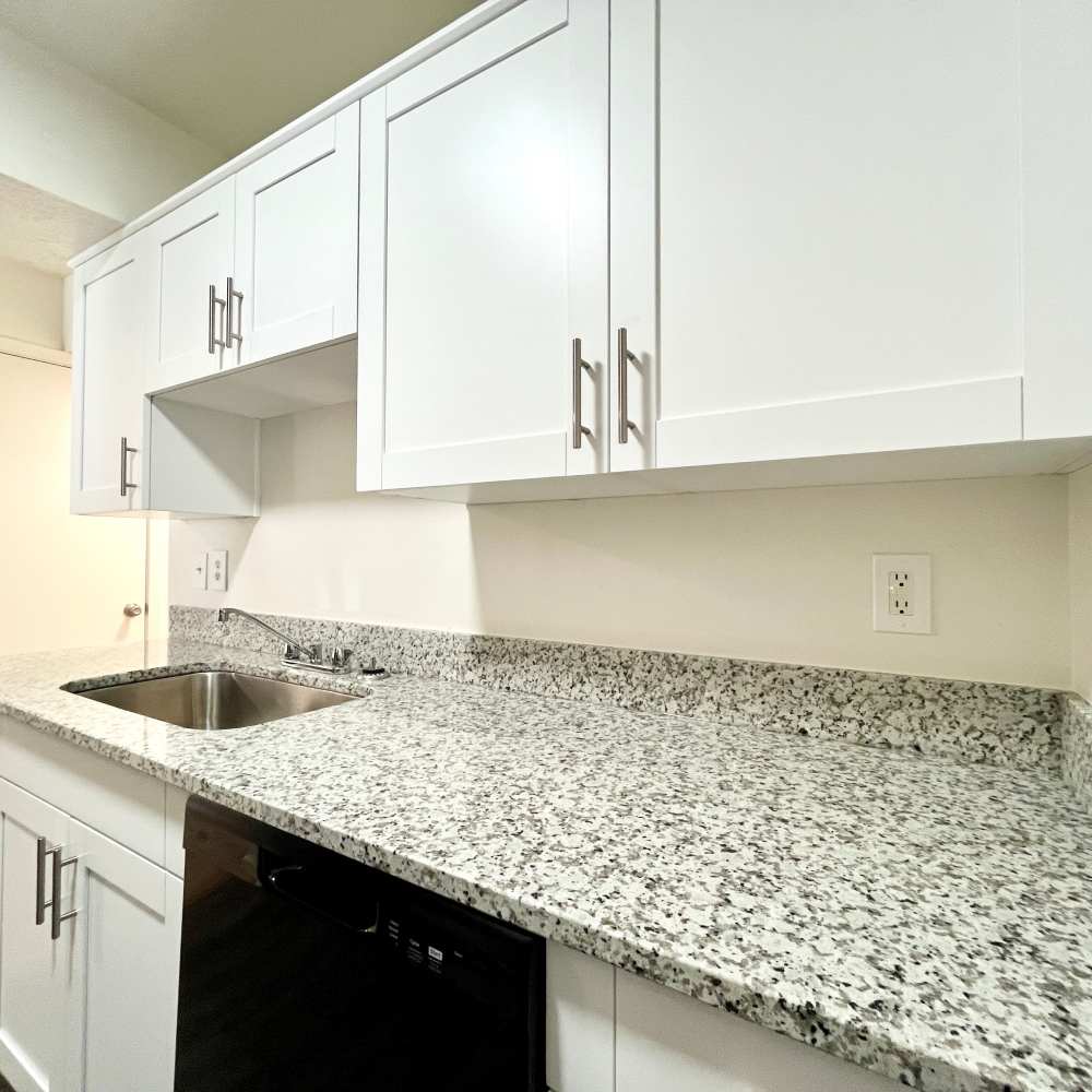 Kitchen with updated cabinets at Collinwood Apartments in Newport News, Virginia