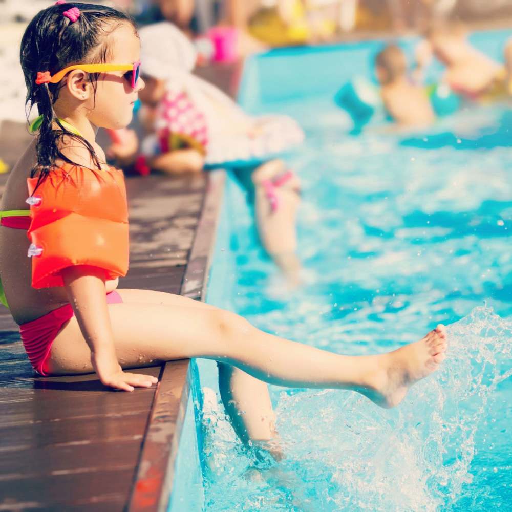 Kids swimming in pool at Lake House in Los Angeles, California