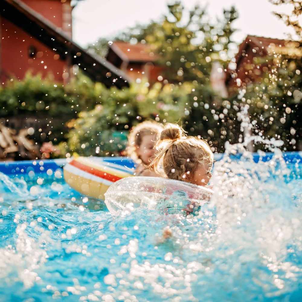 Kids playing in swimming pool at Lake House in Los Angeles, California