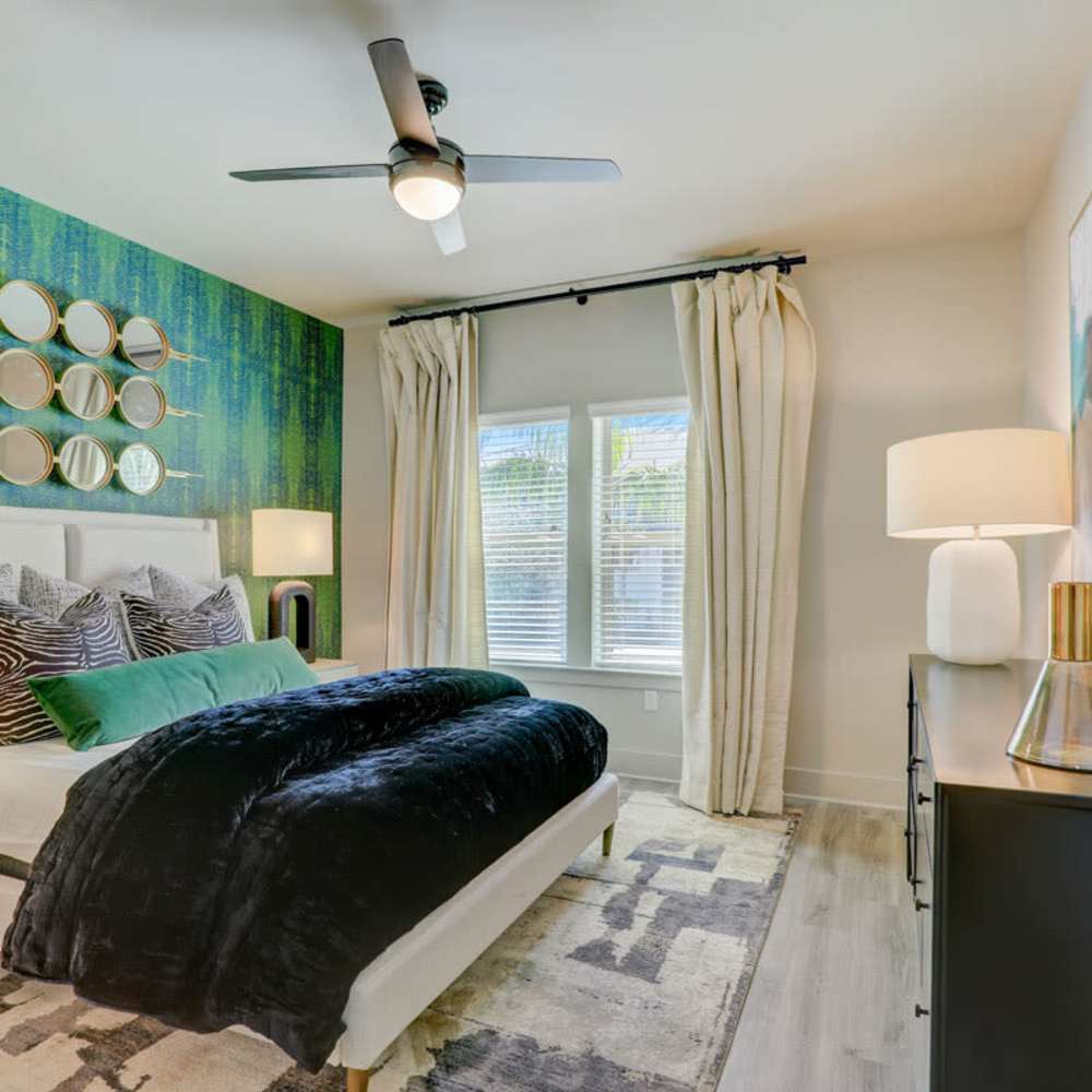 Furnished model bedroom at Tropia Wellen Park in Venice, Florida