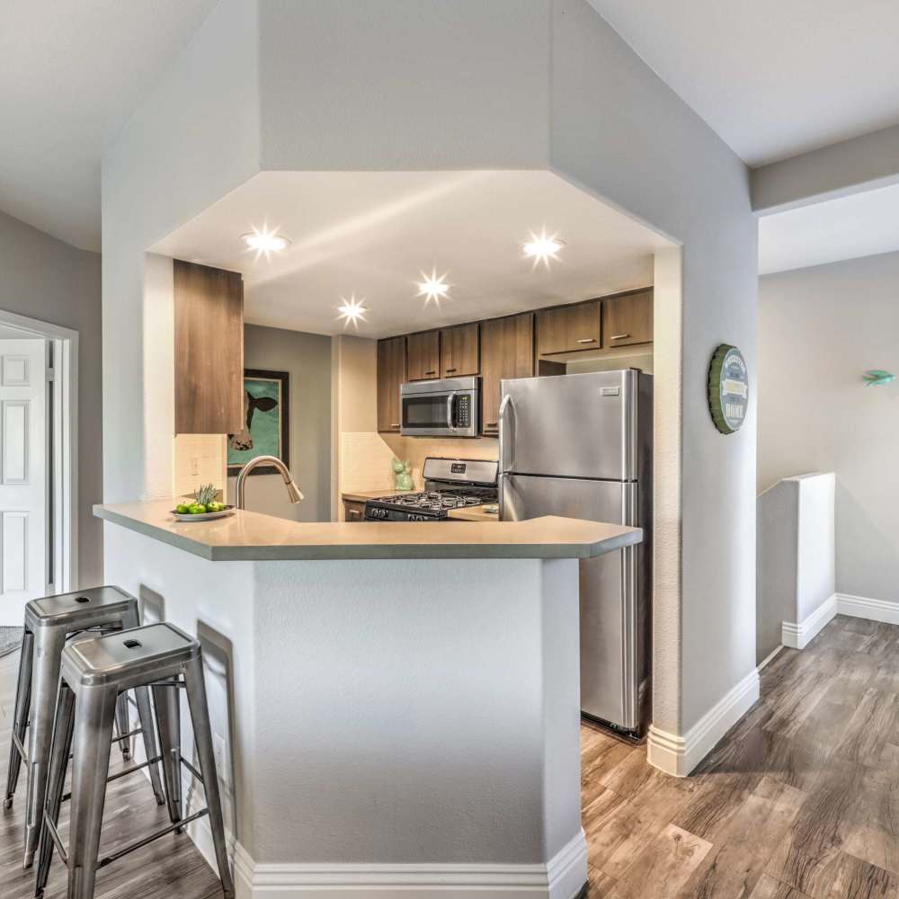 Kitchen with a breakfast bar at Parkway Townhomes in Henderson, Nevada