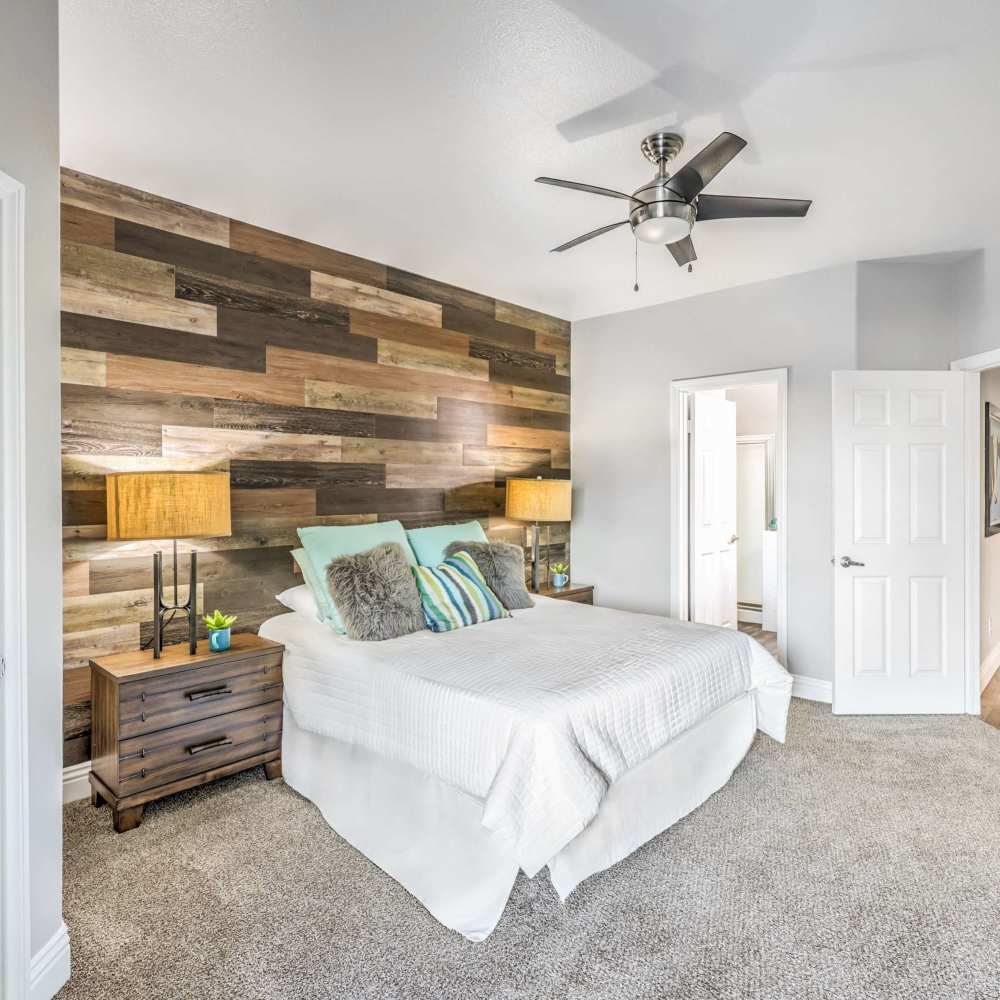Bedroom space with a ceiling fan at Parkway Townhomes in Henderson, Nevada