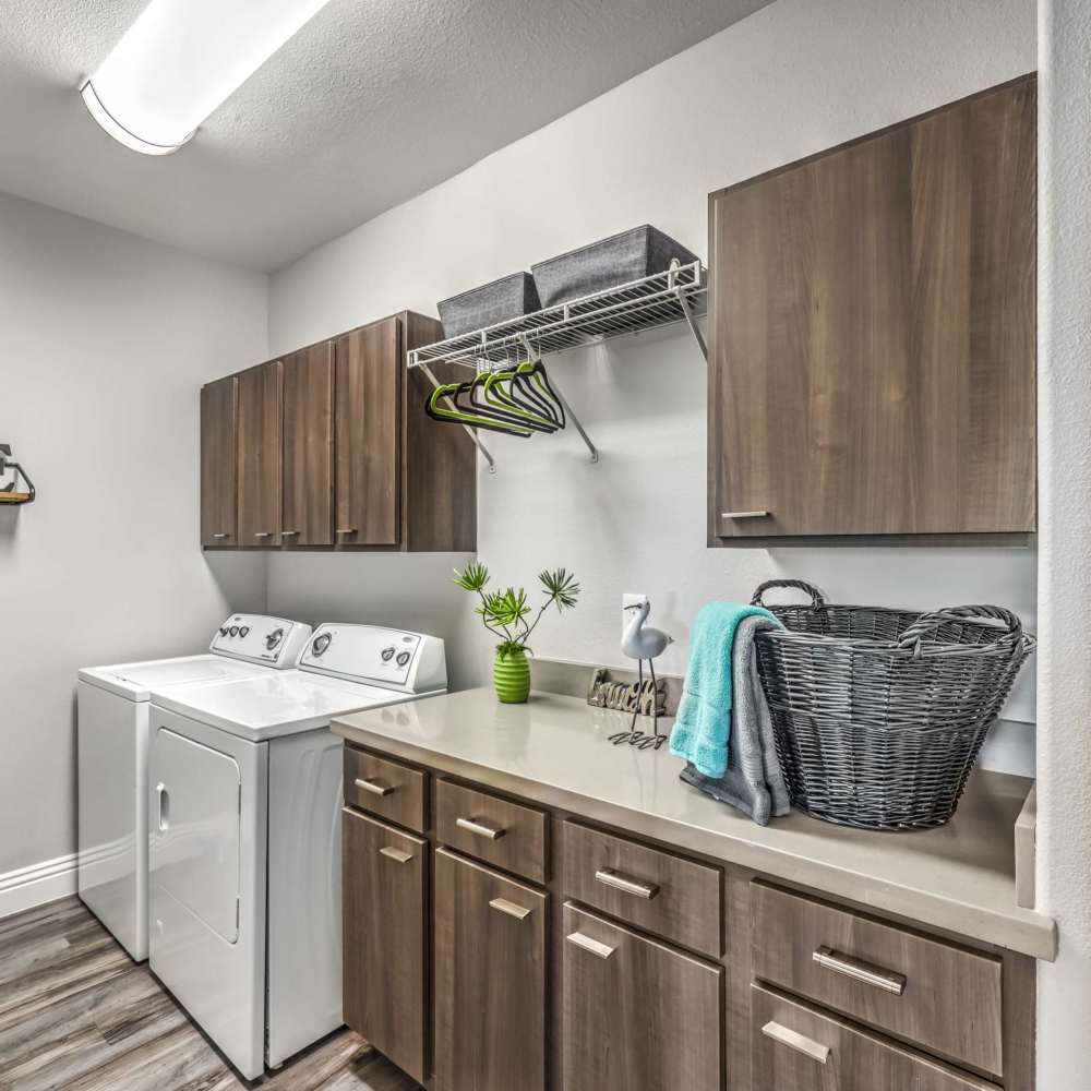 Laundry room with lots of counter and storage space at Parkway Townhomes in Henderson, Nevada