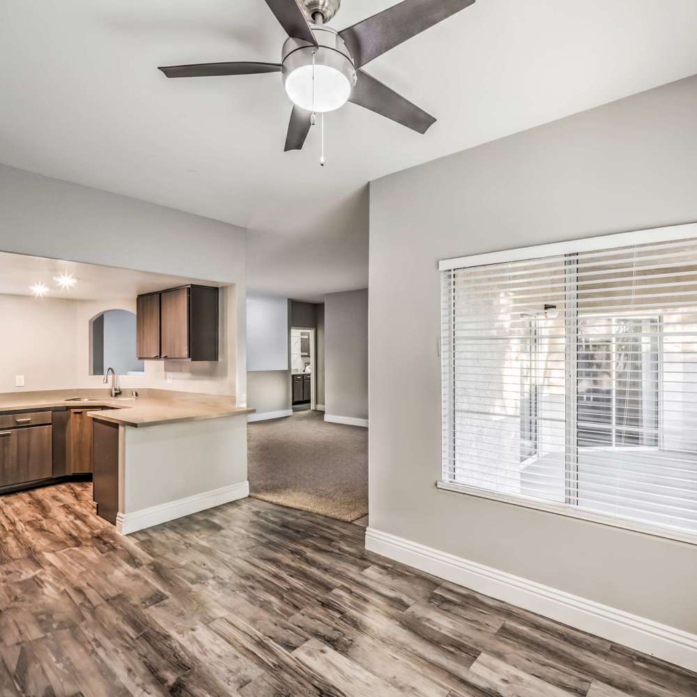 Kitchen and dinning space with wood-style flooring at Parkway Townhomes in Henderson, Nevada