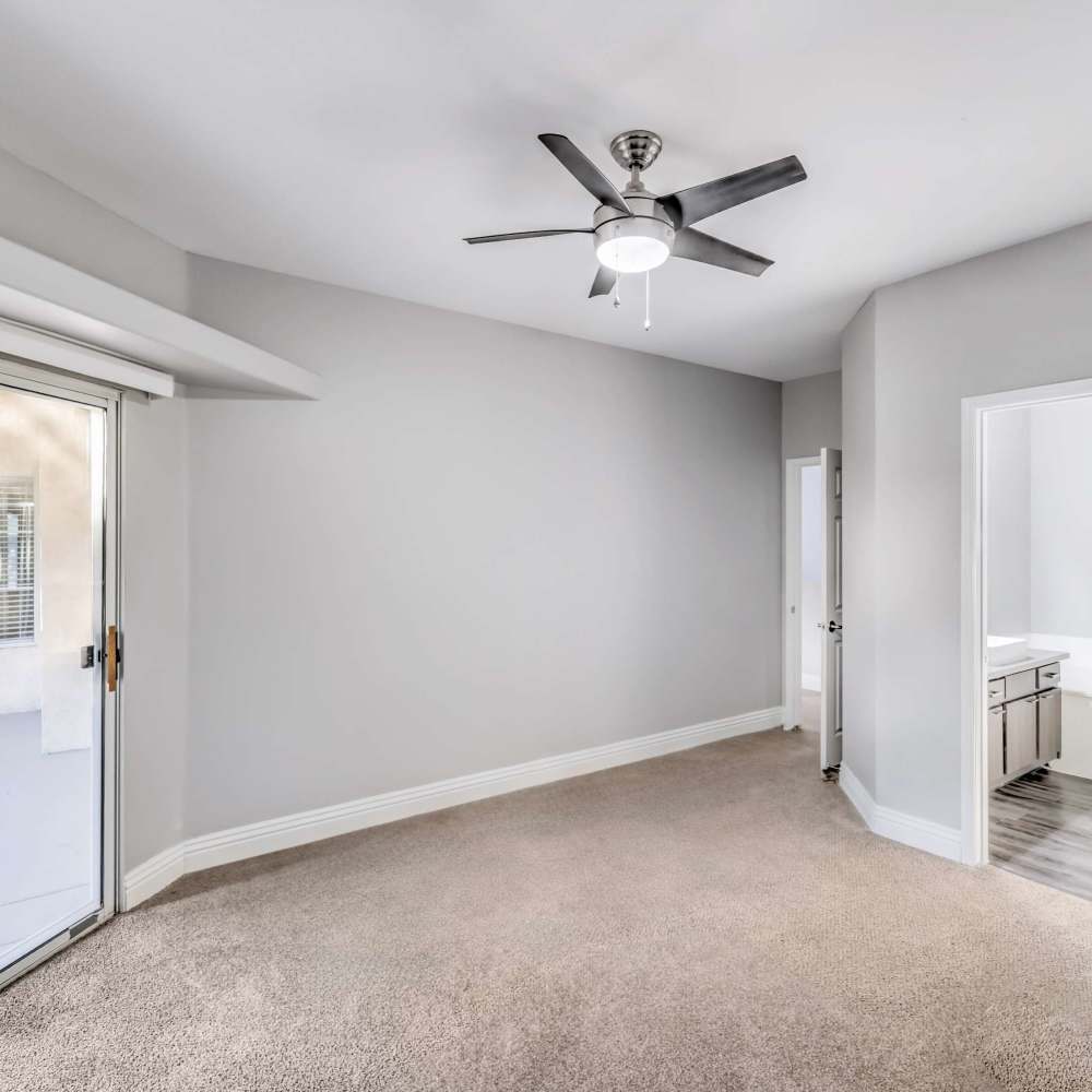 Bedroom with a ceiling fan at Parkway Townhomes in Henderson, Nevada