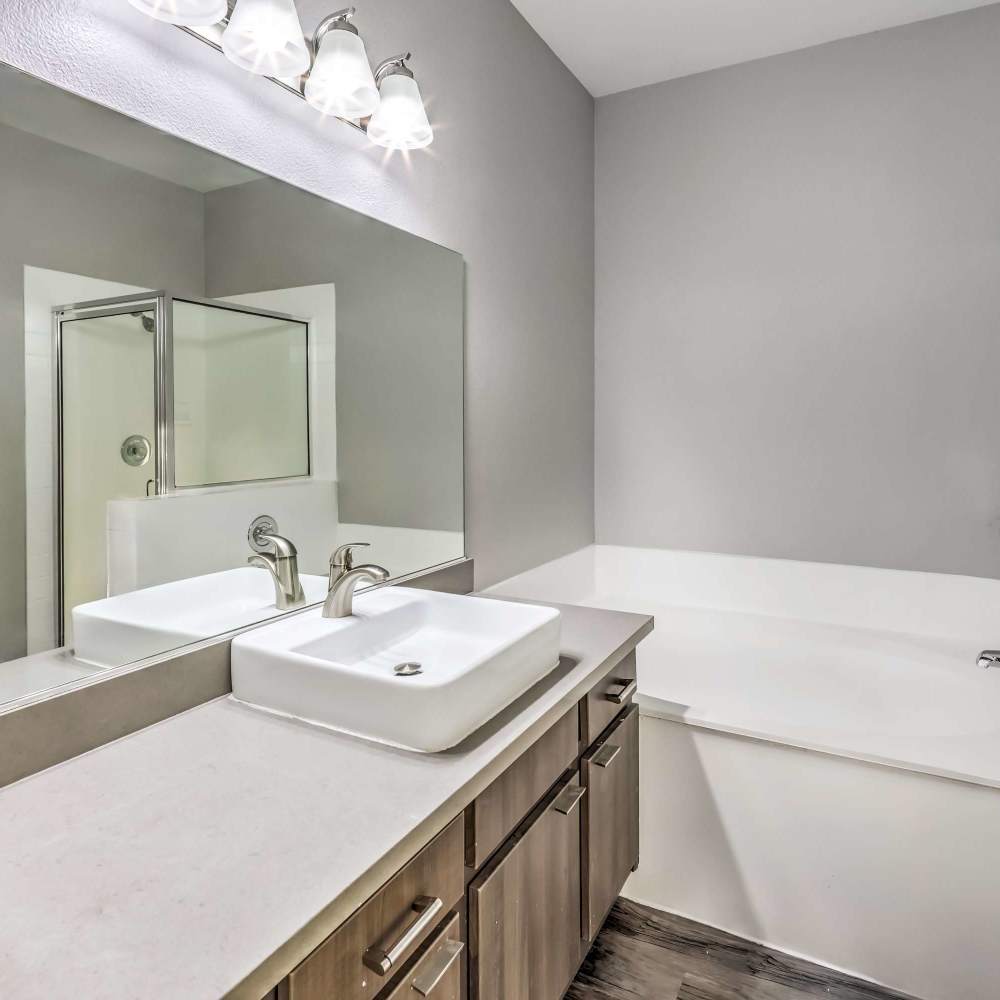 Bathroom with a soaking tub at Parkway Townhomes in Henderson, Nevada