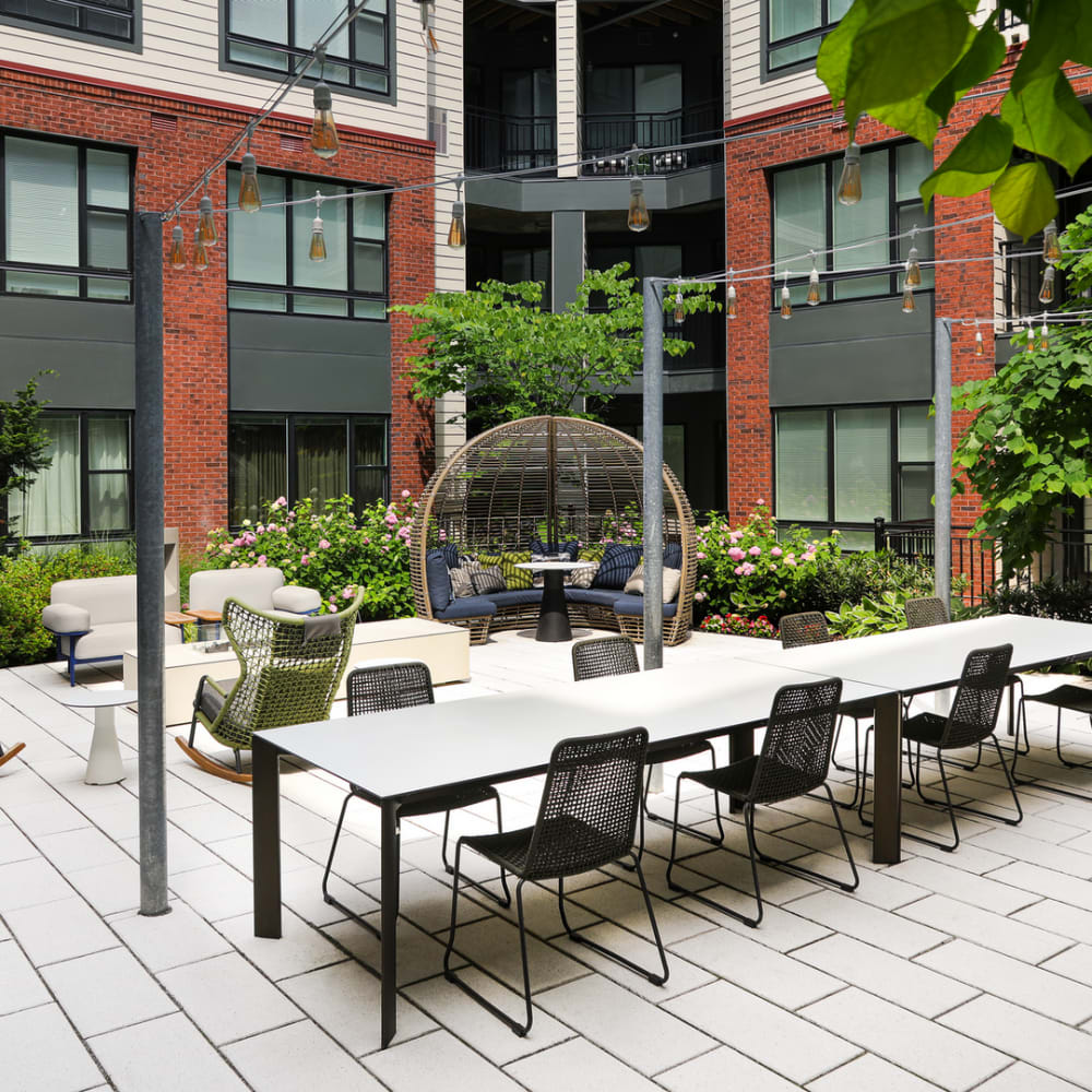 Community patio seating at The Current on River in Hackensack, New Jersey