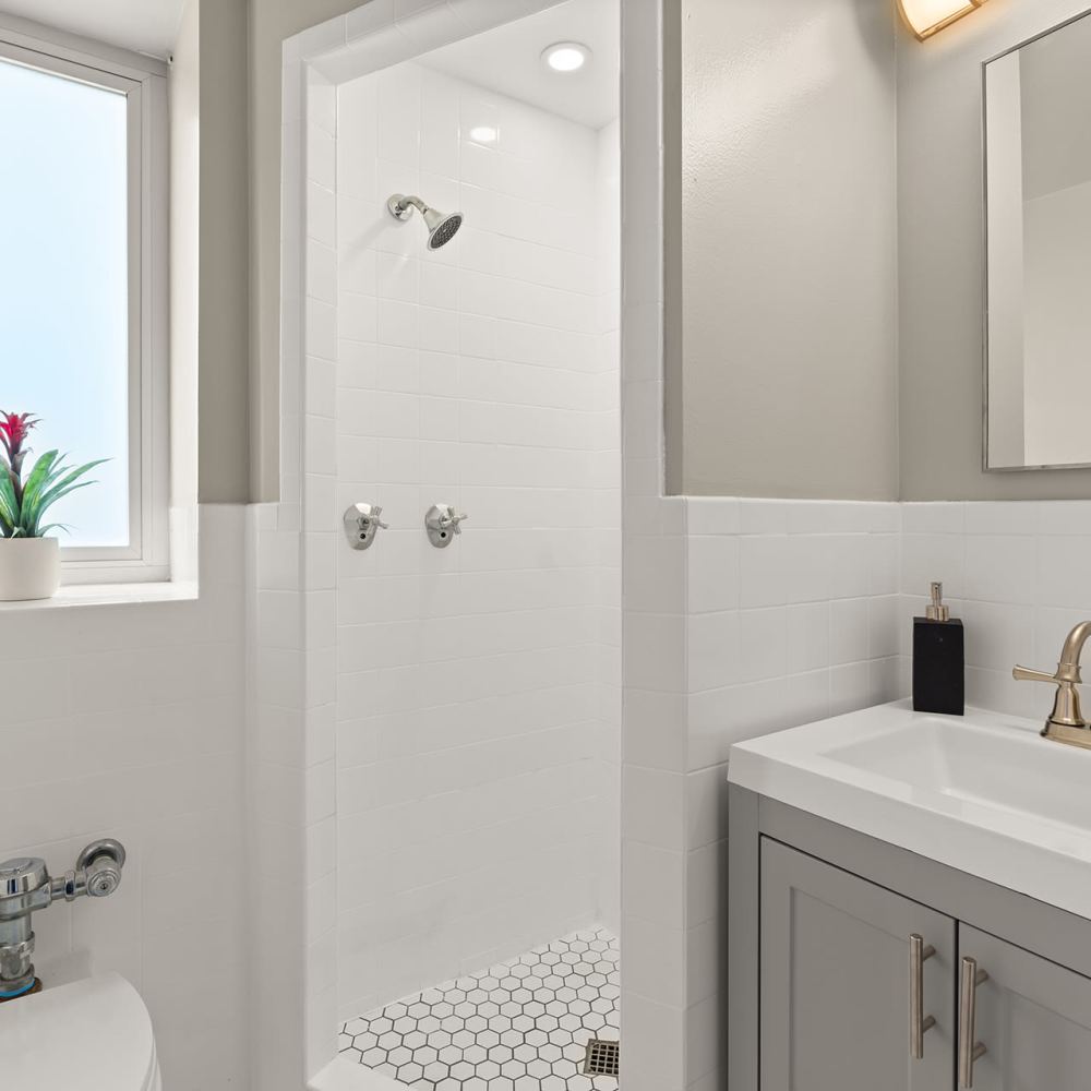 Bathroom with window and mirror at Ryan Tower San Mateo, California