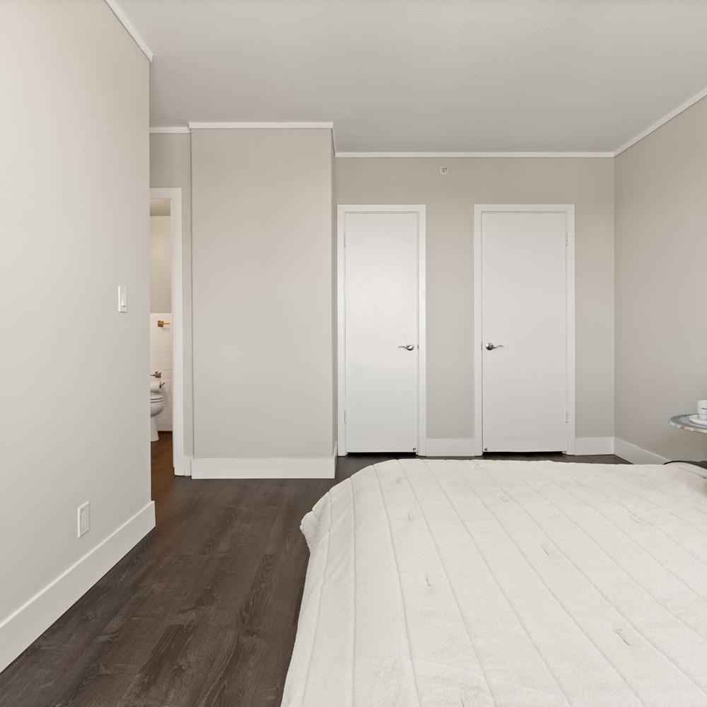 Large bedroom with closet doors at Ryan Tower San Mateo, California