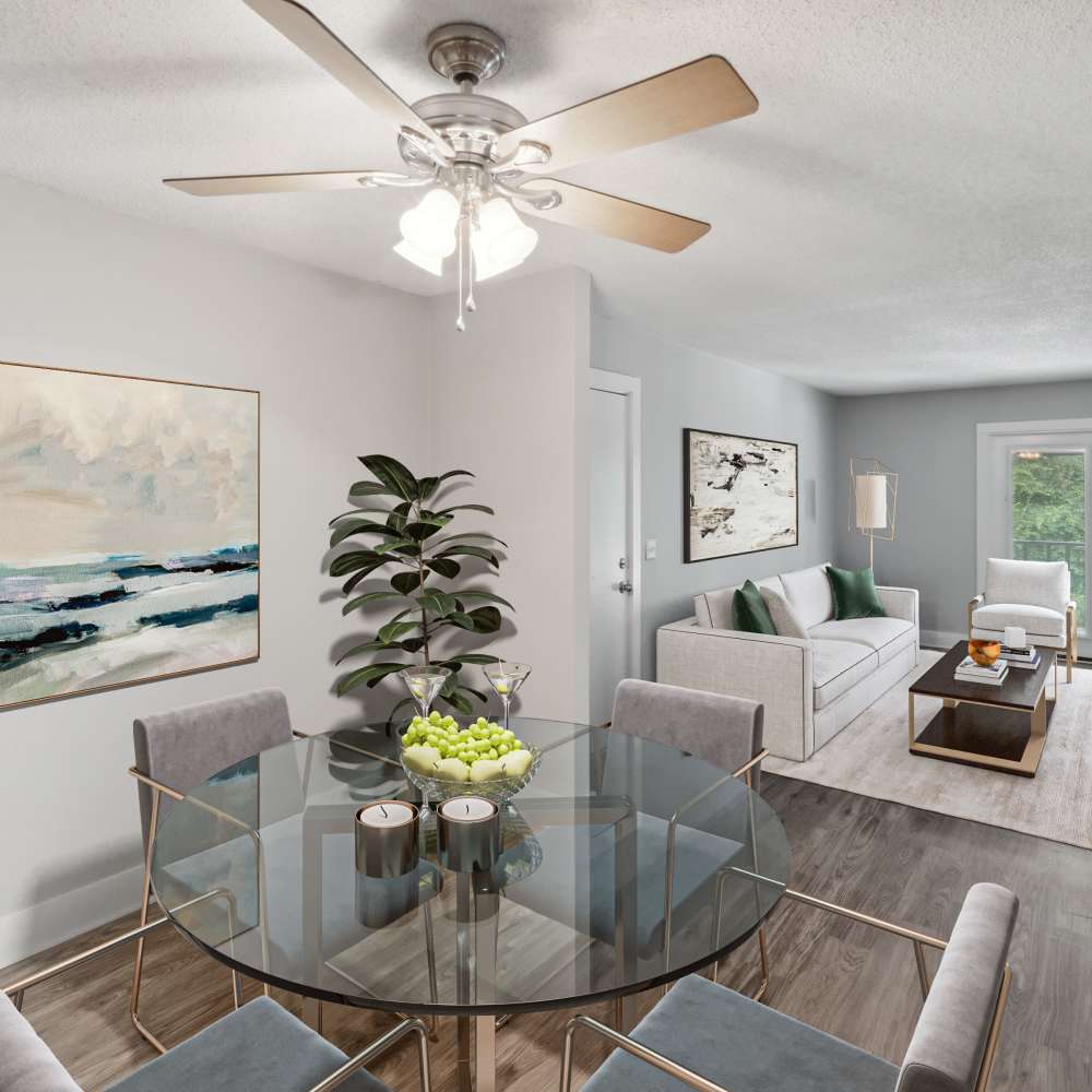 Spacious living room with premium furniture and wood-style flooring at Nottingham Apartments in Hendersonville, Tennessee