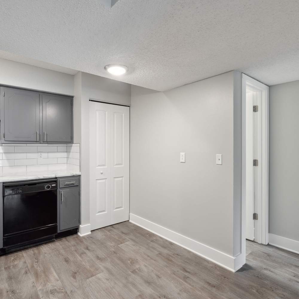 Empty layout of kitchen with a built-in Owen and gas stove at Nottingham Apartments in Hendersonville, Tennessee
