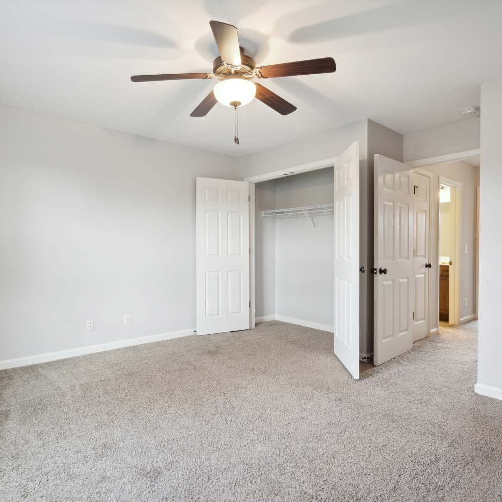 Spacious room with carpeted flooring and double door closet at Northpark Commons in Clarksville, Tennessee