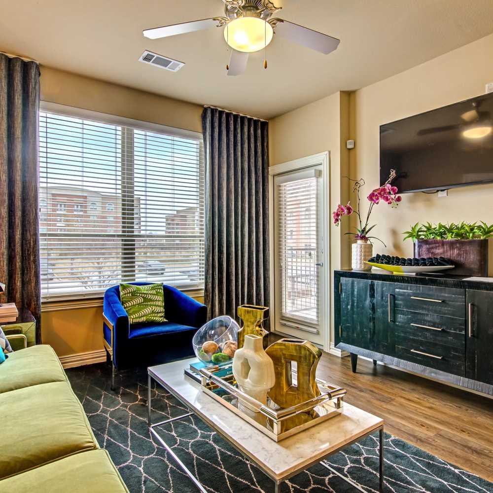 Model living room in an apartment at Keller Springs Crossing in Carrollton, Texas