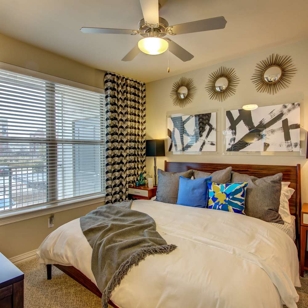 Furnished model bedroom in an apartment at Keller Springs Crossing in Carrollton, Texas