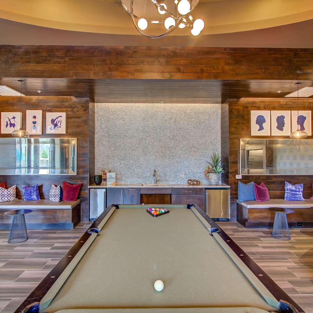 Billiards table with pool balls on it at Keller Springs Crossing in Carrollton, Texas