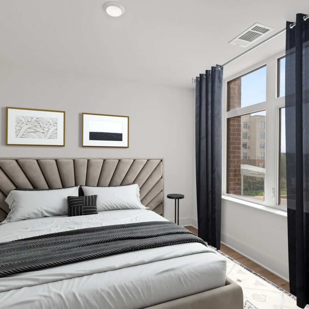 Cozy bedroom in a model home at The Elysian at Stonefield in Charlottesville, Virginia