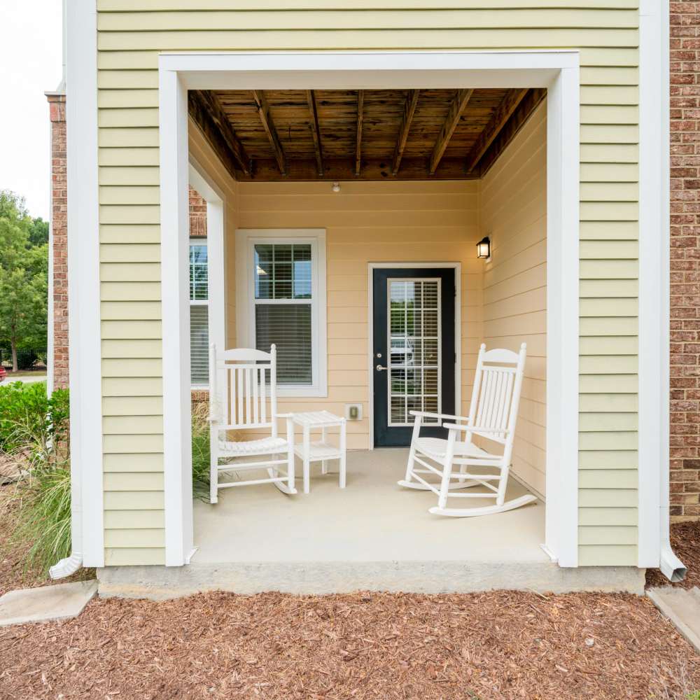 Private porch with rocking chairs at The Reserve at White Oak in Garner, North Carolina