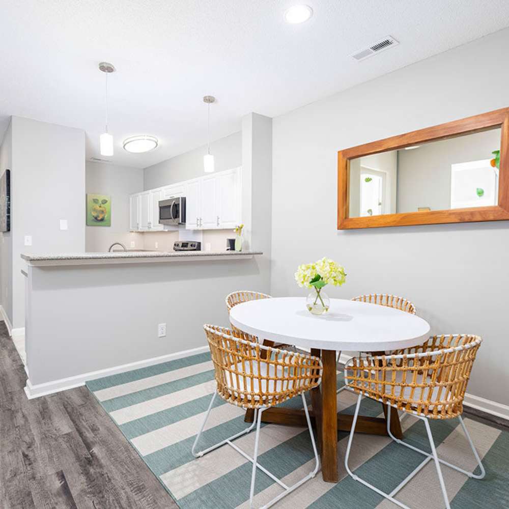 Dining and living area of an apartment home at Heron Reserve in Charleston, South Carolina