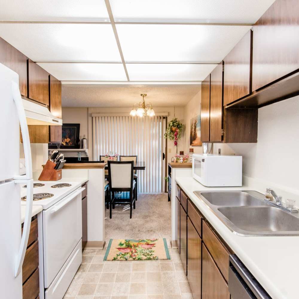Fully furnished apartment kitchen at Campus View Apartments in Federal Way, Washington