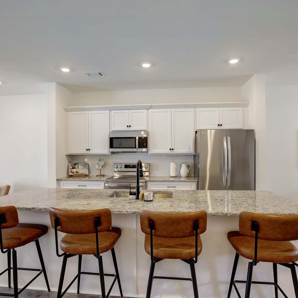 Kitchen with breakfast island and barstool at Blakeney Commons in Smyrna, Tennessee