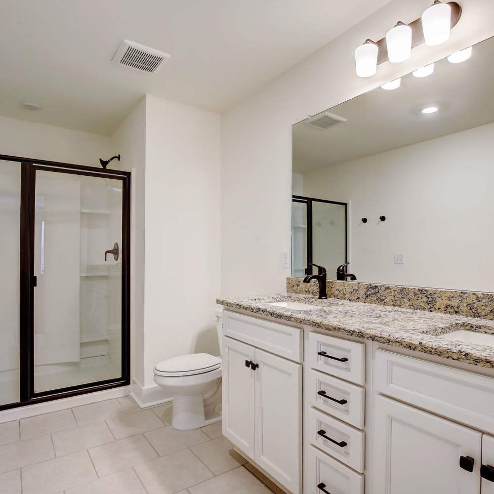 Bathroom with vanity mirror at Blakeney Commons in Smyrna, Tennessee