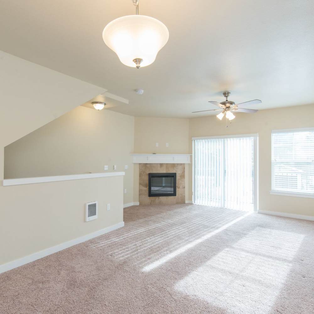 Living room with fireplace at  Wynstone Townhomes in Puyallup, Washington