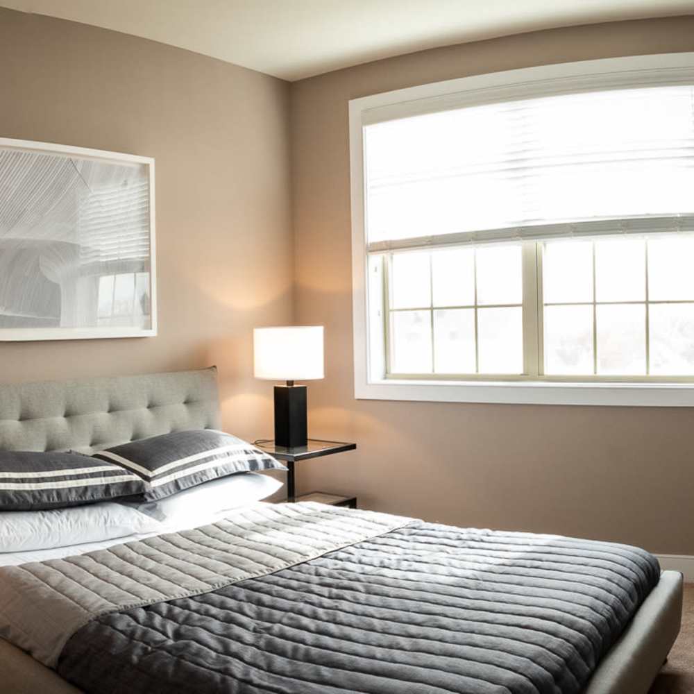 Queen-size bed with matching end tables at Station Place in Red Bank, New Jersey