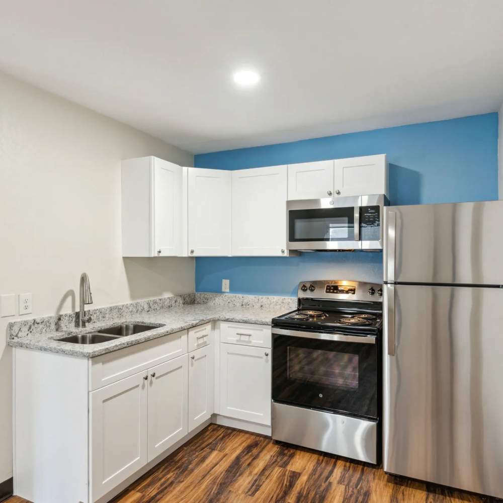 Kitchen with stainless-steel appliances at Atrium Flats in Nashville, Tennessee