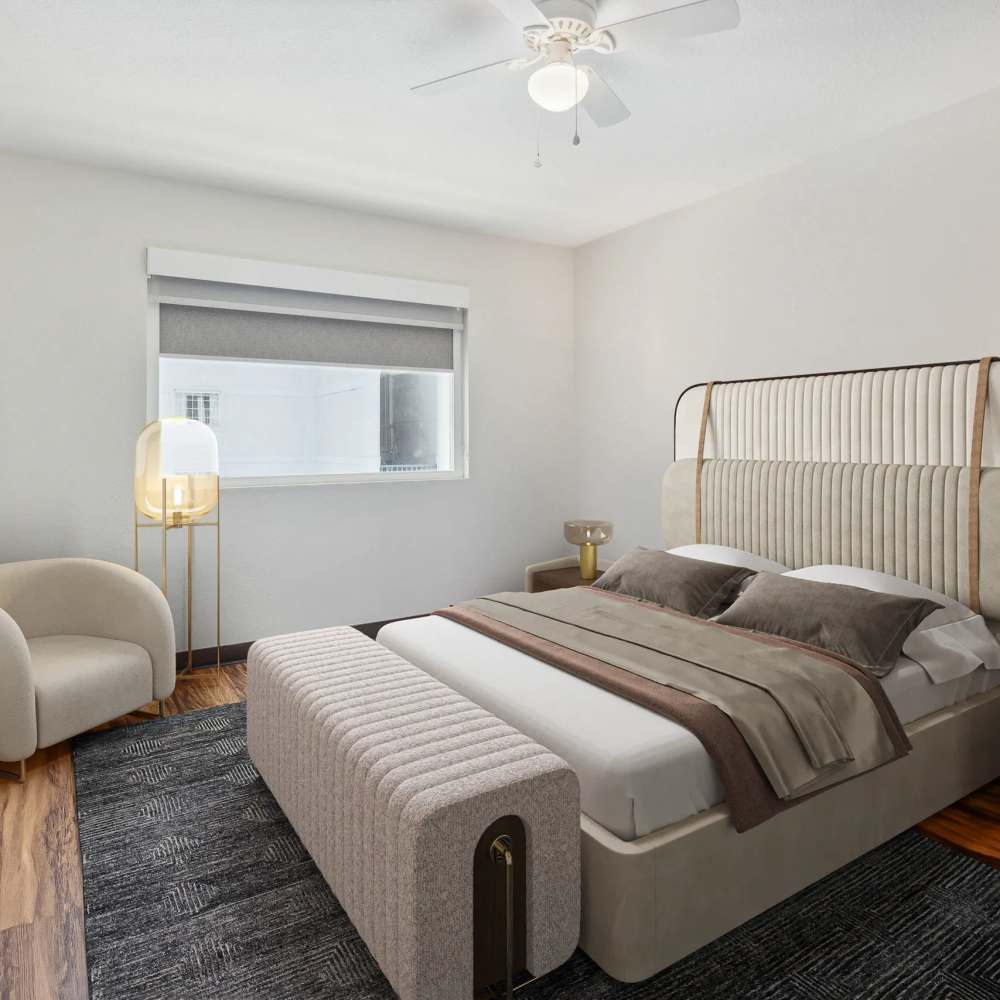 Bedroom with a ceiling fan at Atrium Flats in Nashville, Tennessee