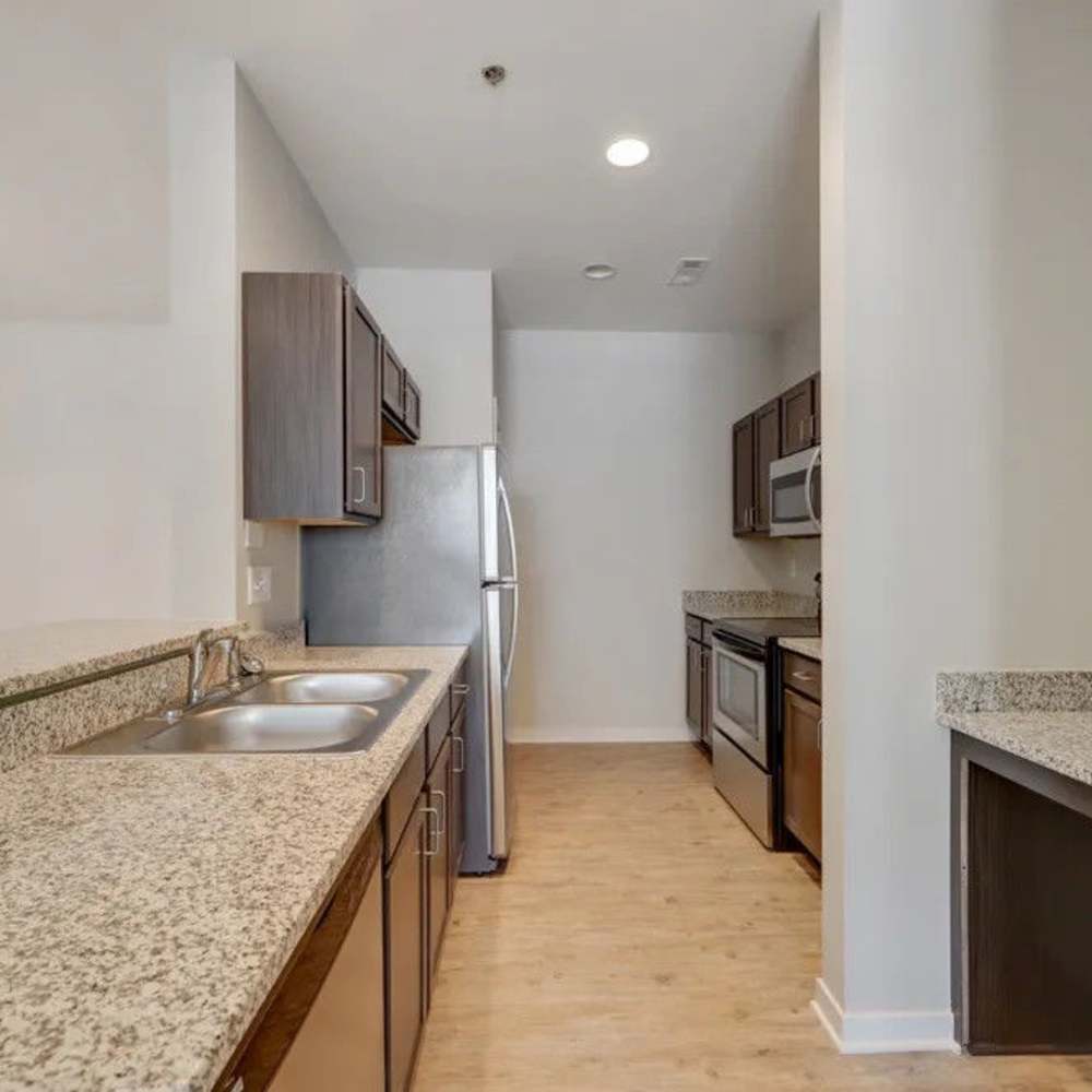 Apartment kitchen at Creekside At Deer Crossings in White House, Tennessee