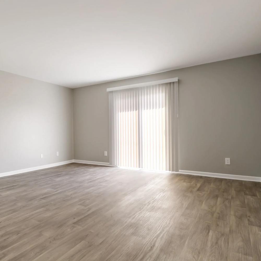 Living room with wood-style flooring at The Flats At Wilkinson in White House, Tennessee