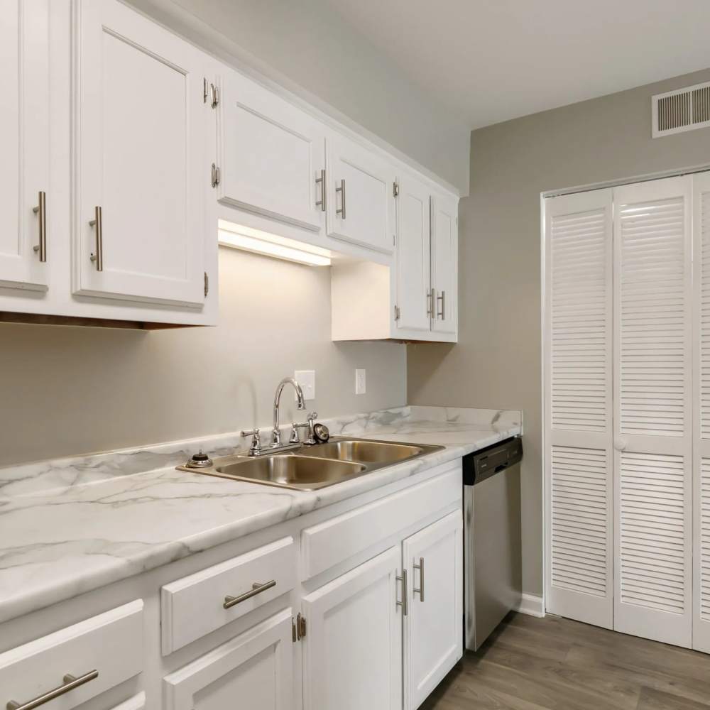 White cupboards with modern hardware in a kitchen at The Flats At Wilkinson in White House, Tennessee