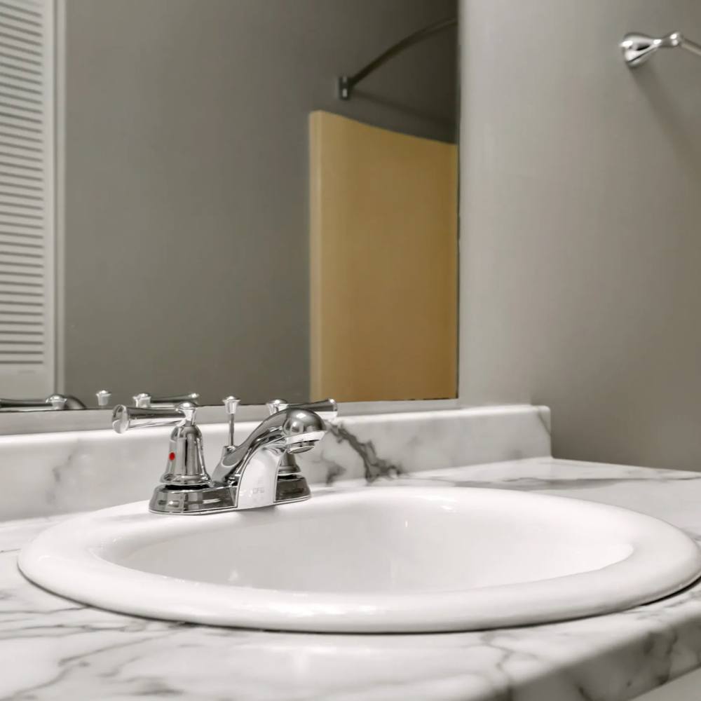 Granite counters in an apartment bathroom at The Flats At Wilkinson in White House, Tennessee