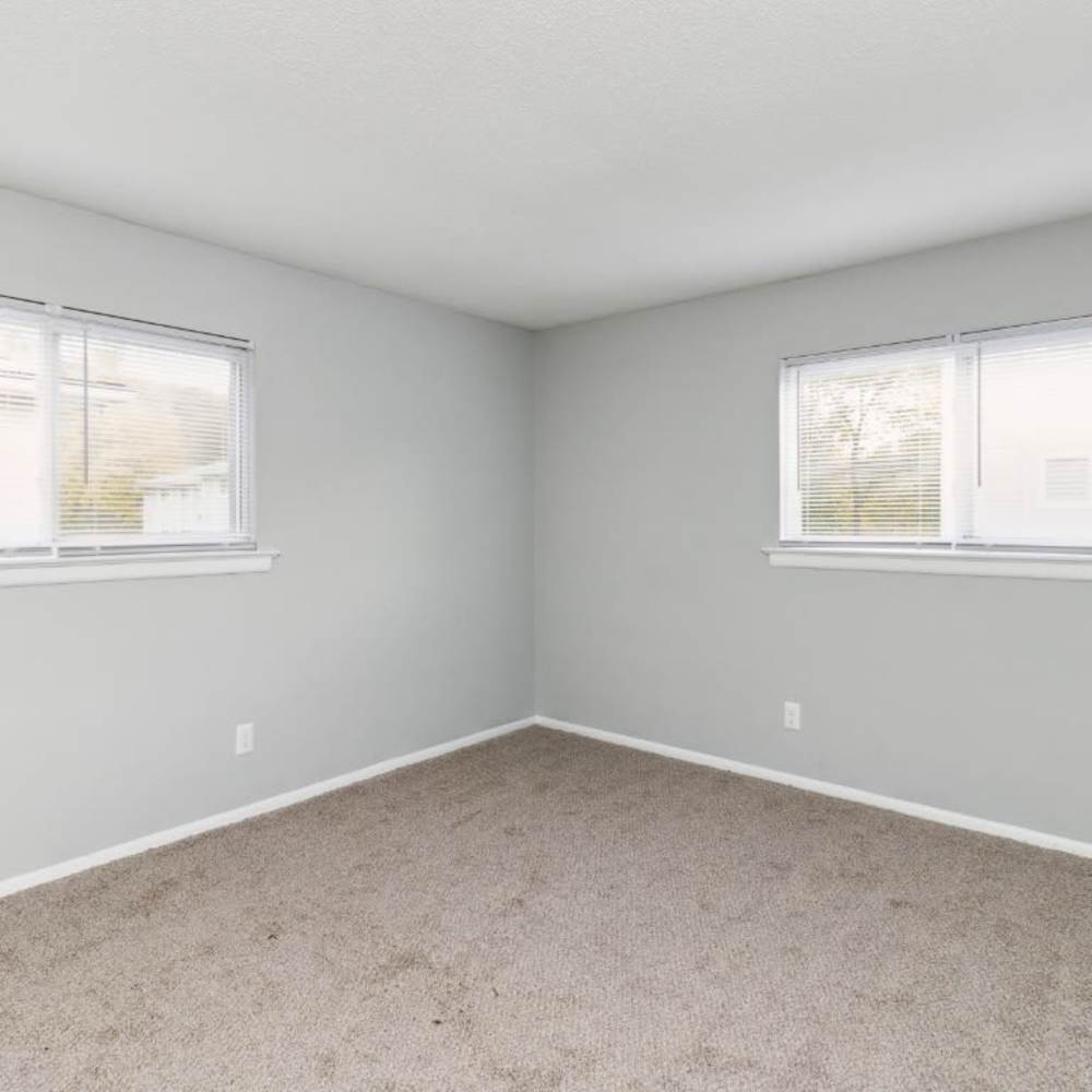 Bedroom with two window at Willow Creek Apartments in Chattanooga, Tennessee