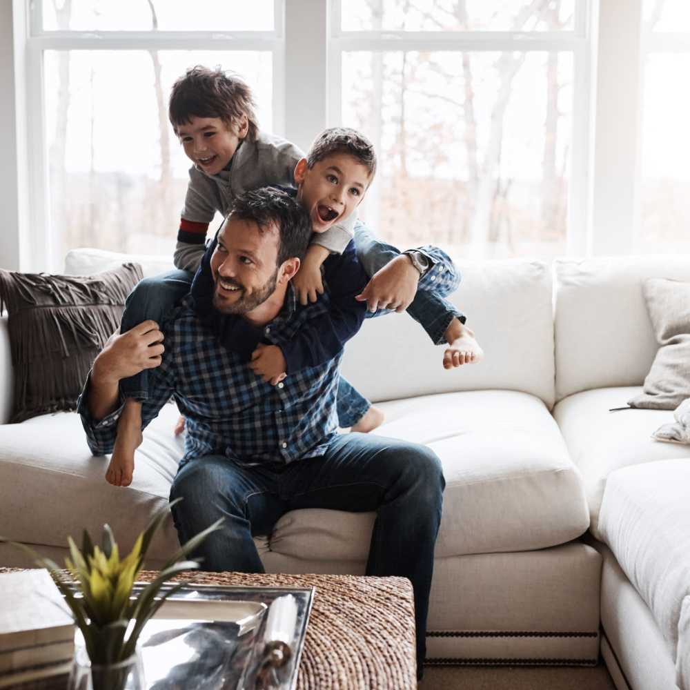 Resident playing with his children at home Hacienda Commons in Pleasanton, California