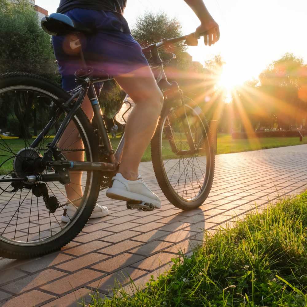 Resident riding a bike near The Meadowlark at Fairview in Fairview, Oregon