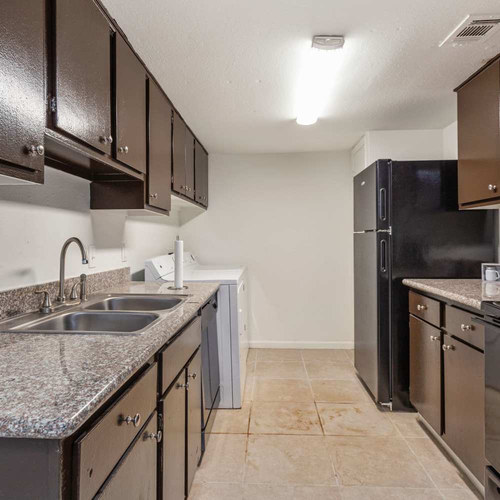 Kitchen with a dishwasher at Huntington Village And Cambridge Crossing in Houston, Texas