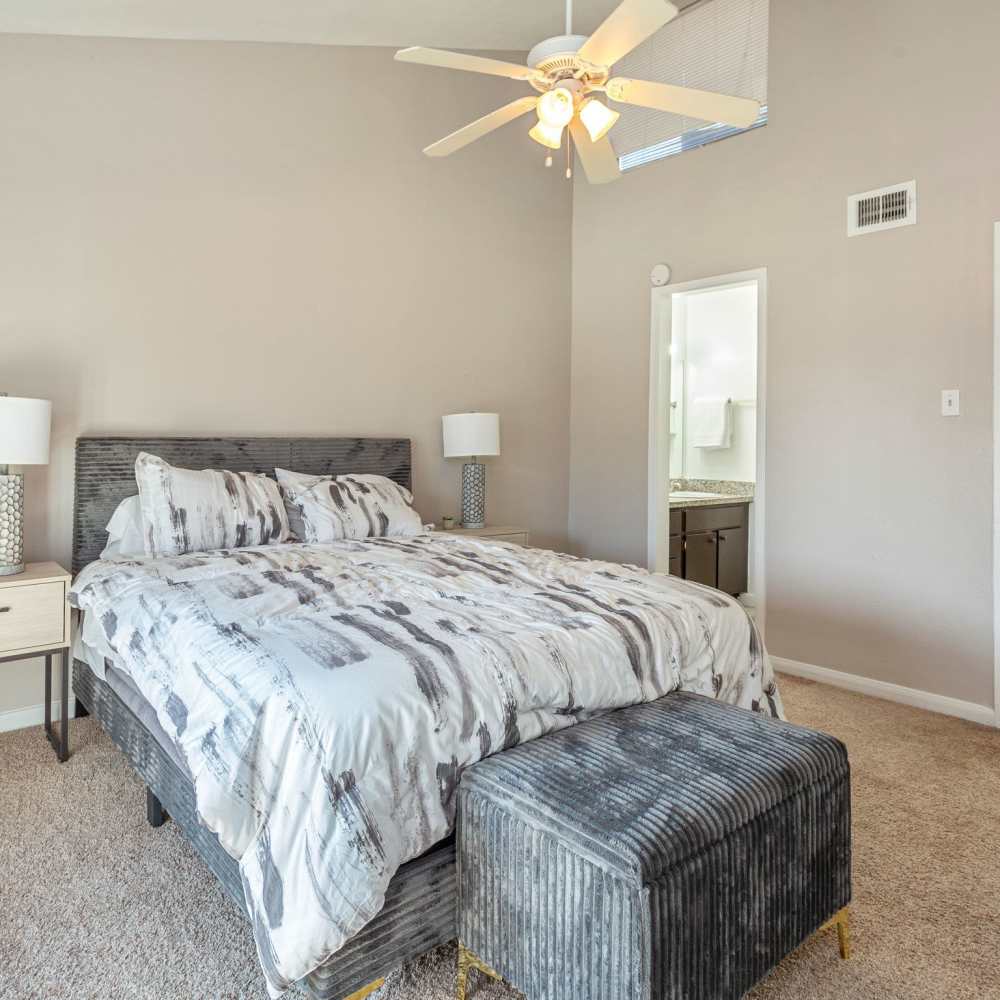 Bedroom with a bed and nightstand at Huntington Village And Cambridge Crossing in Houston, Texas