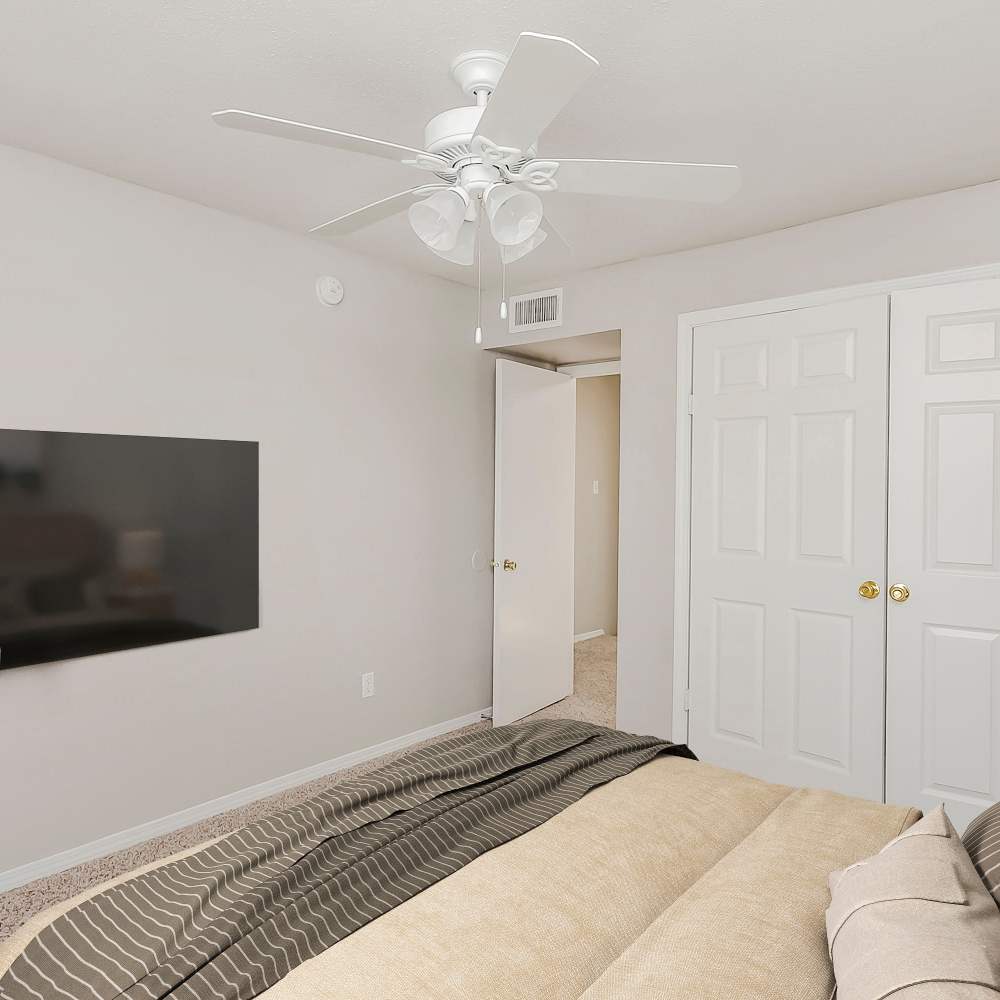 Bedroom with a ceiling fan at Huntington Village And Cambridge Crossing in Houston, Texas