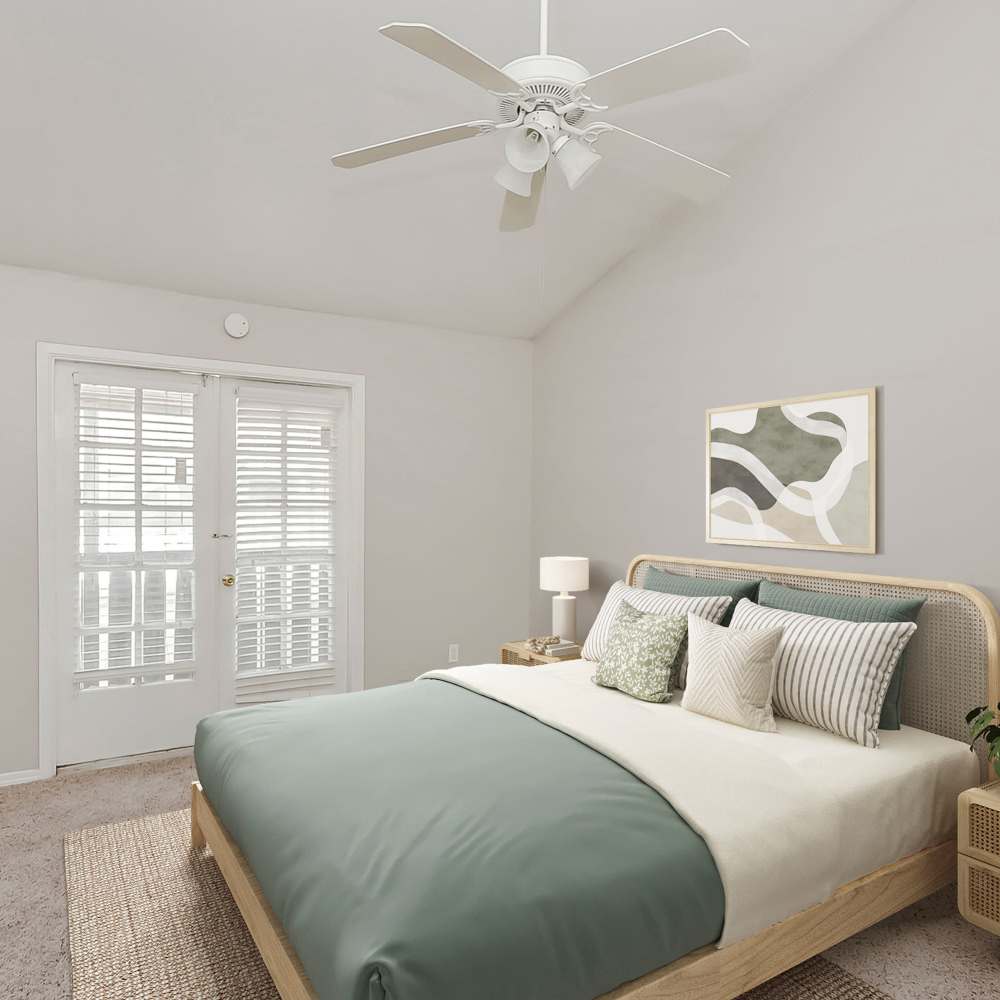 Bedroom with access to a balcony or patio at Huntington Village And Cambridge Crossing in Houston, Texas