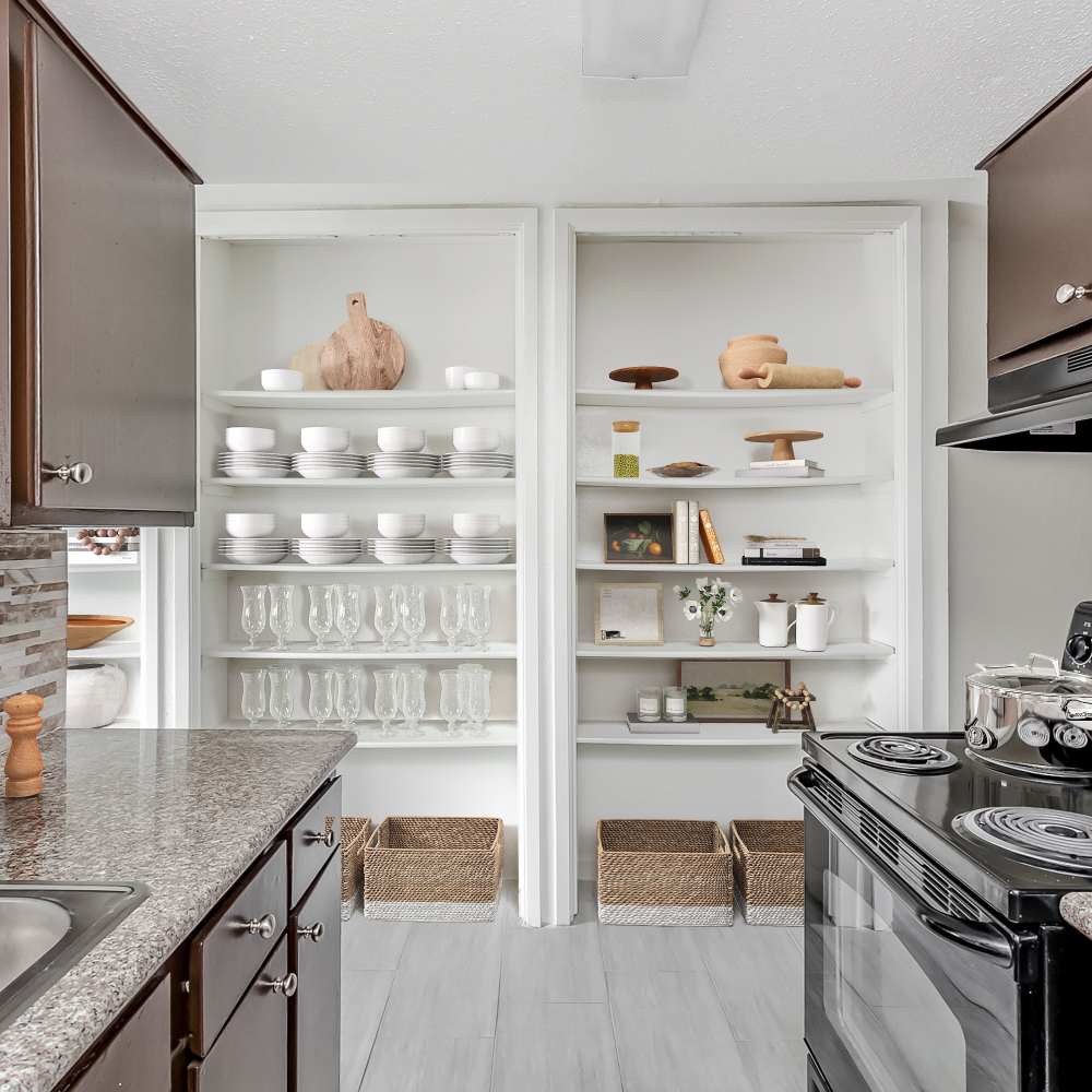 Built in shelving outside the kitchen at Huntington Village And Cambridge Crossing in Houston, Texas