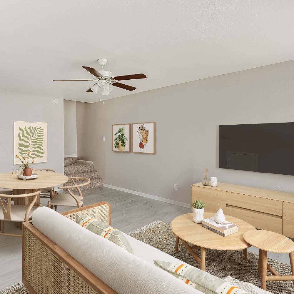 Living space with wood-style flooring at Huntington Village And Cambridge Crossing in Houston, Texas
